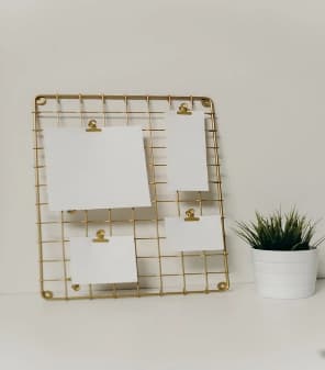 Memo board with cards clipped to it